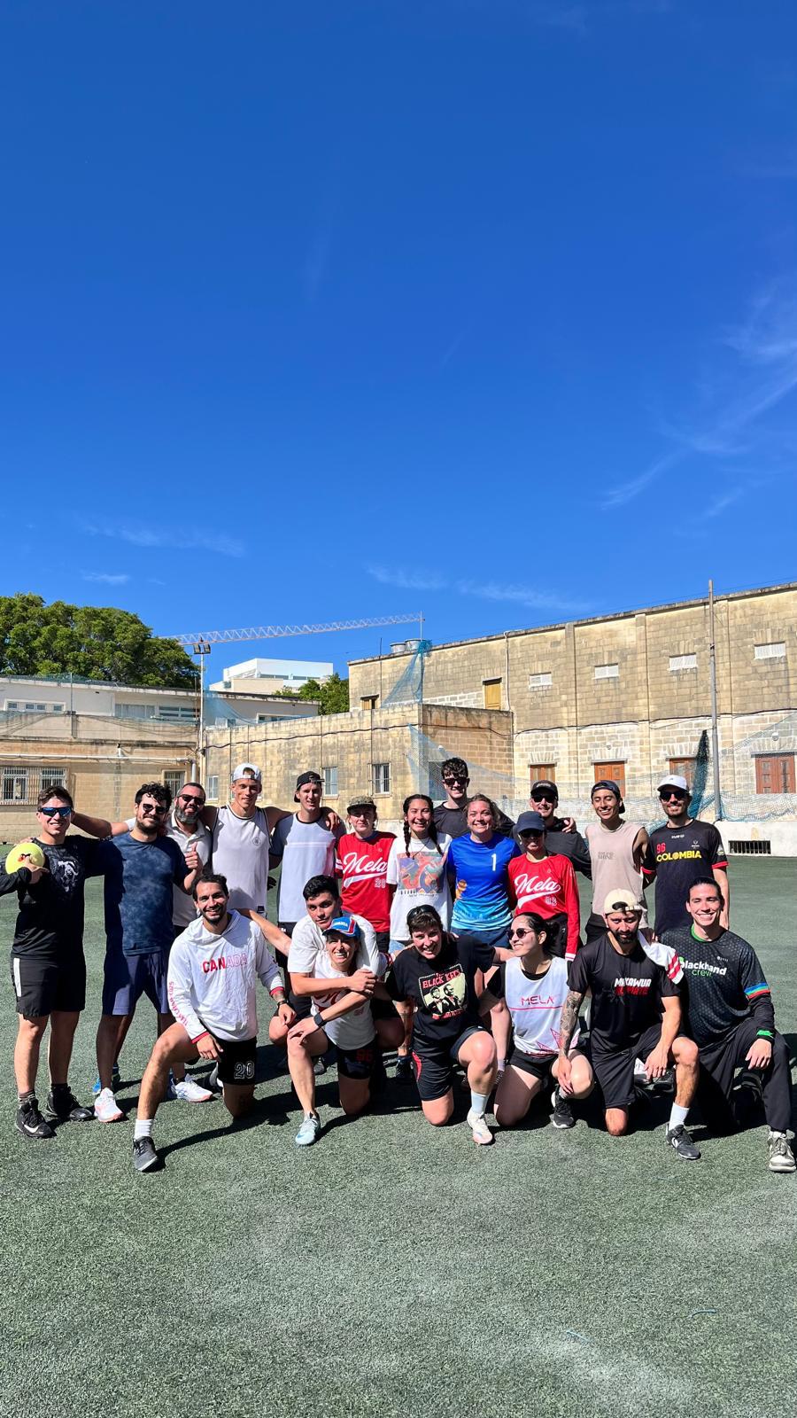 Mela Ultimate players together on the pitch after a daytime session in Attard