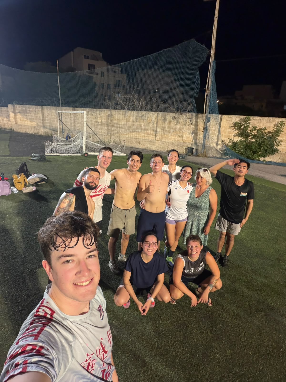 Group photo of Mela Ultimate players after a late training session in Attard